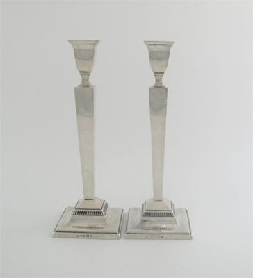 Appraisal: A pair of modern candlesticks square tapering form on a