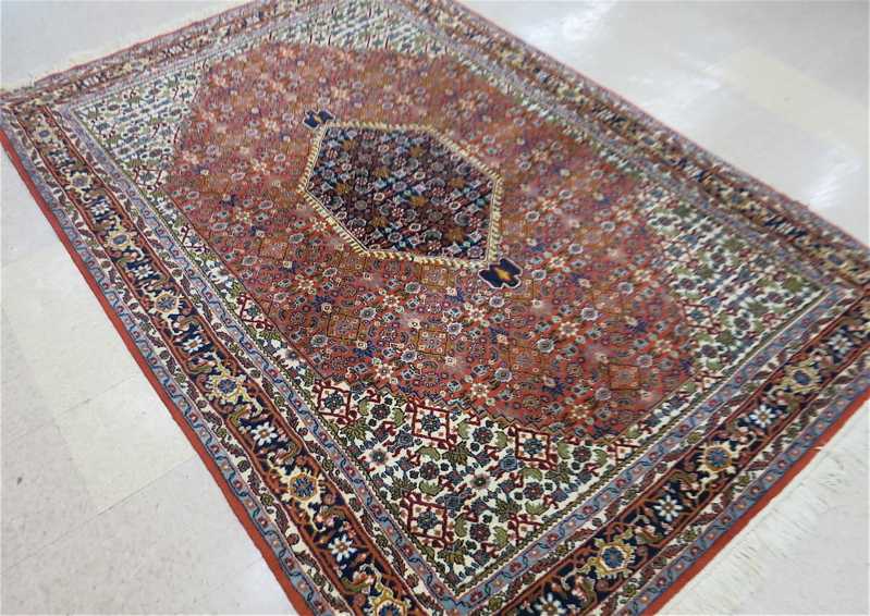 Appraisal: HAND KNOTTED ORIENTAL CARPET Indo-Persian Bijar Herati floral design on