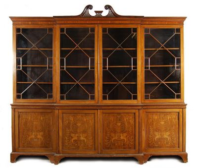 Appraisal: A late Victorian mahogany and marquetry inlaid breakfront library bookcase