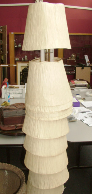 Appraisal: A contemporary standard lamp on circular wooden base with pleated