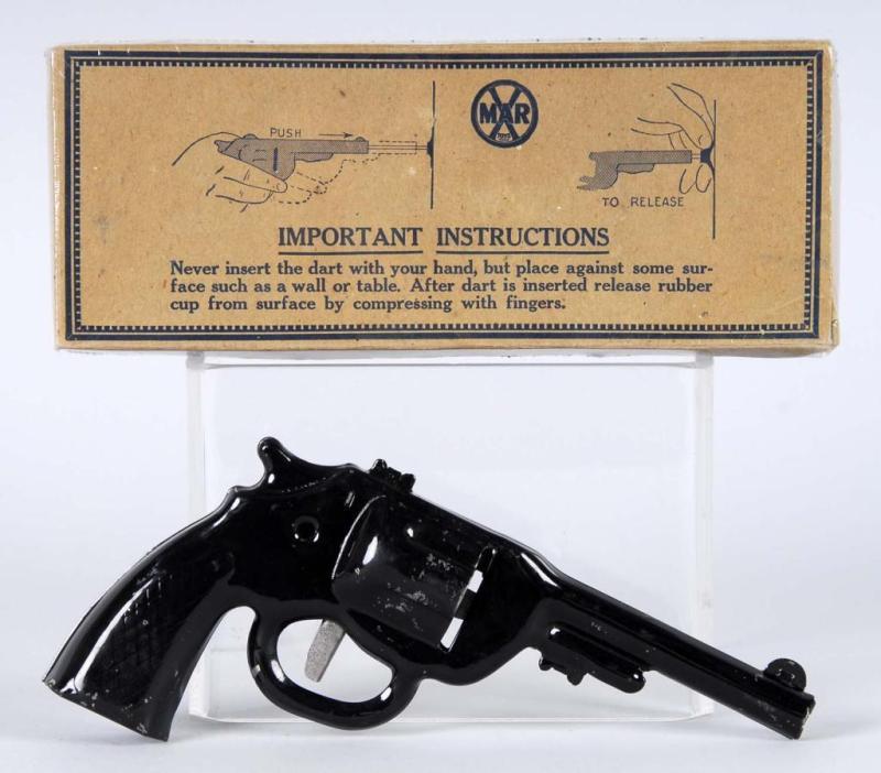 Appraisal: Black Tin Clicker Dart Gun Description Includes box Condition Excellent