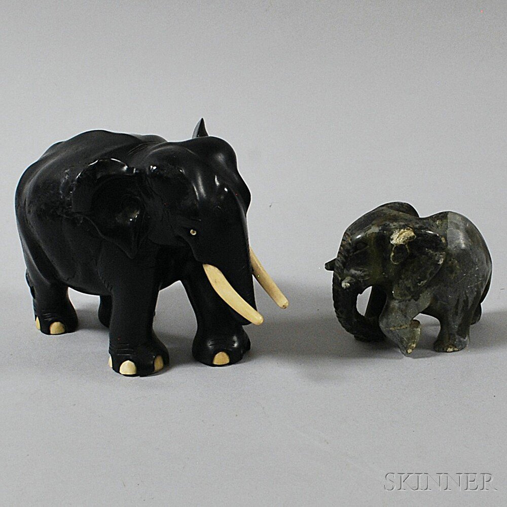 Appraisal: Two Carved Elephants a soapstone elephant signed E Mavura on