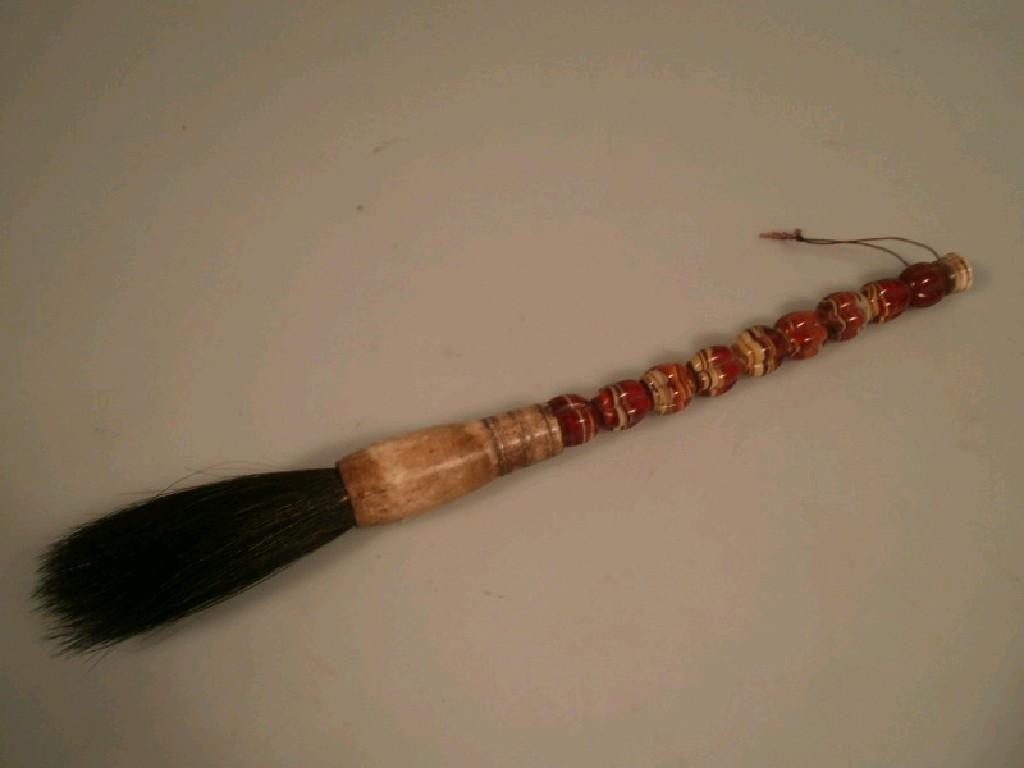 Appraisal: A Chinese paintbrush the handle made of marbled beads