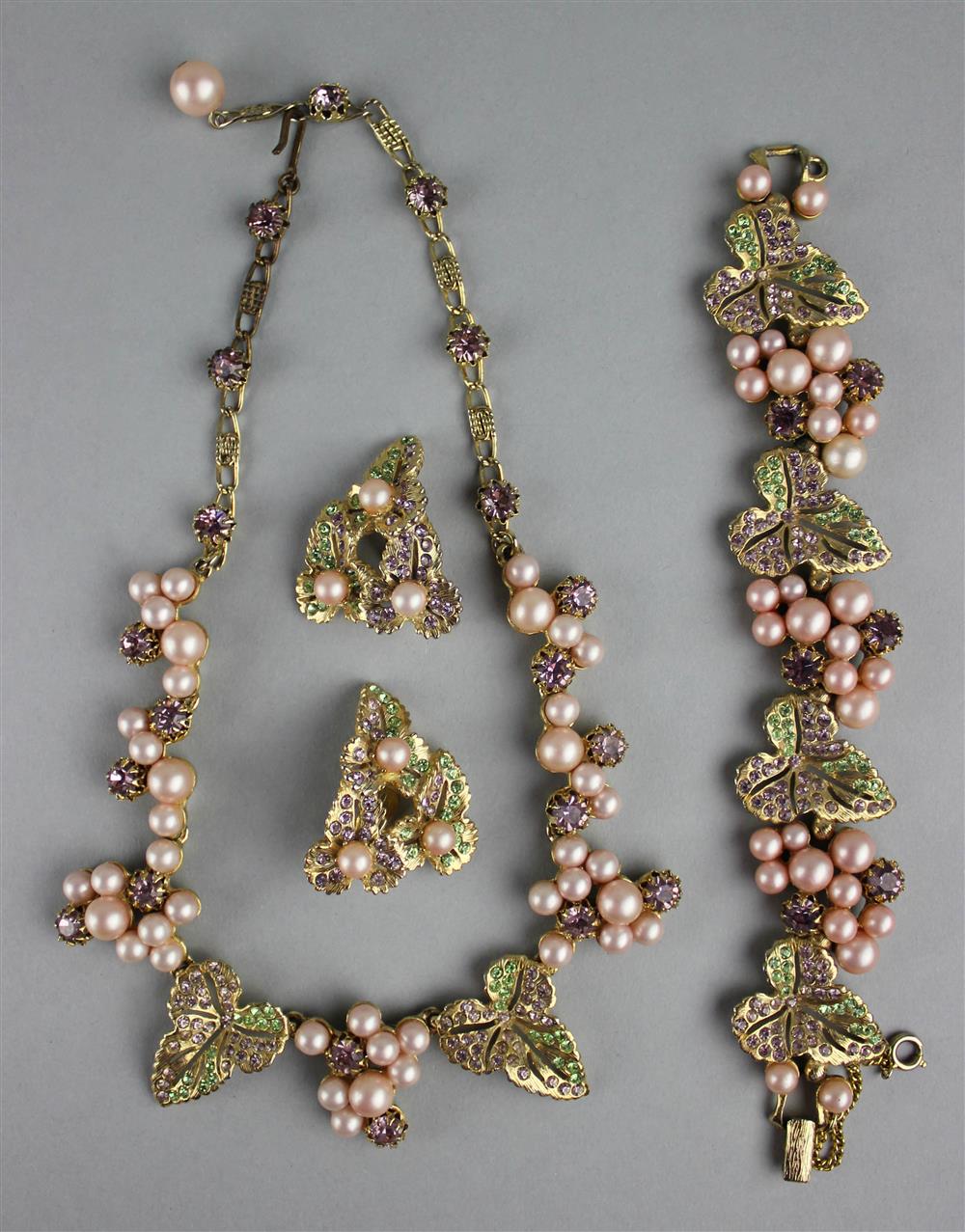 Appraisal: ELSA SCHIAPARELLI PARURE stylized leaf and grapes with pink pearls