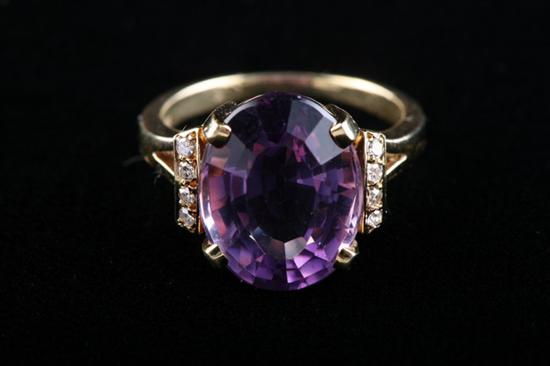 Appraisal: K YELLOW GOLD AMETHYST AND DIAMOND RING ct oval amethyst