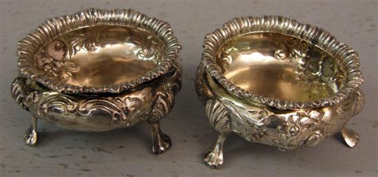 Appraisal: Pair of late Victorian silver salts with embossed scrolling foliage