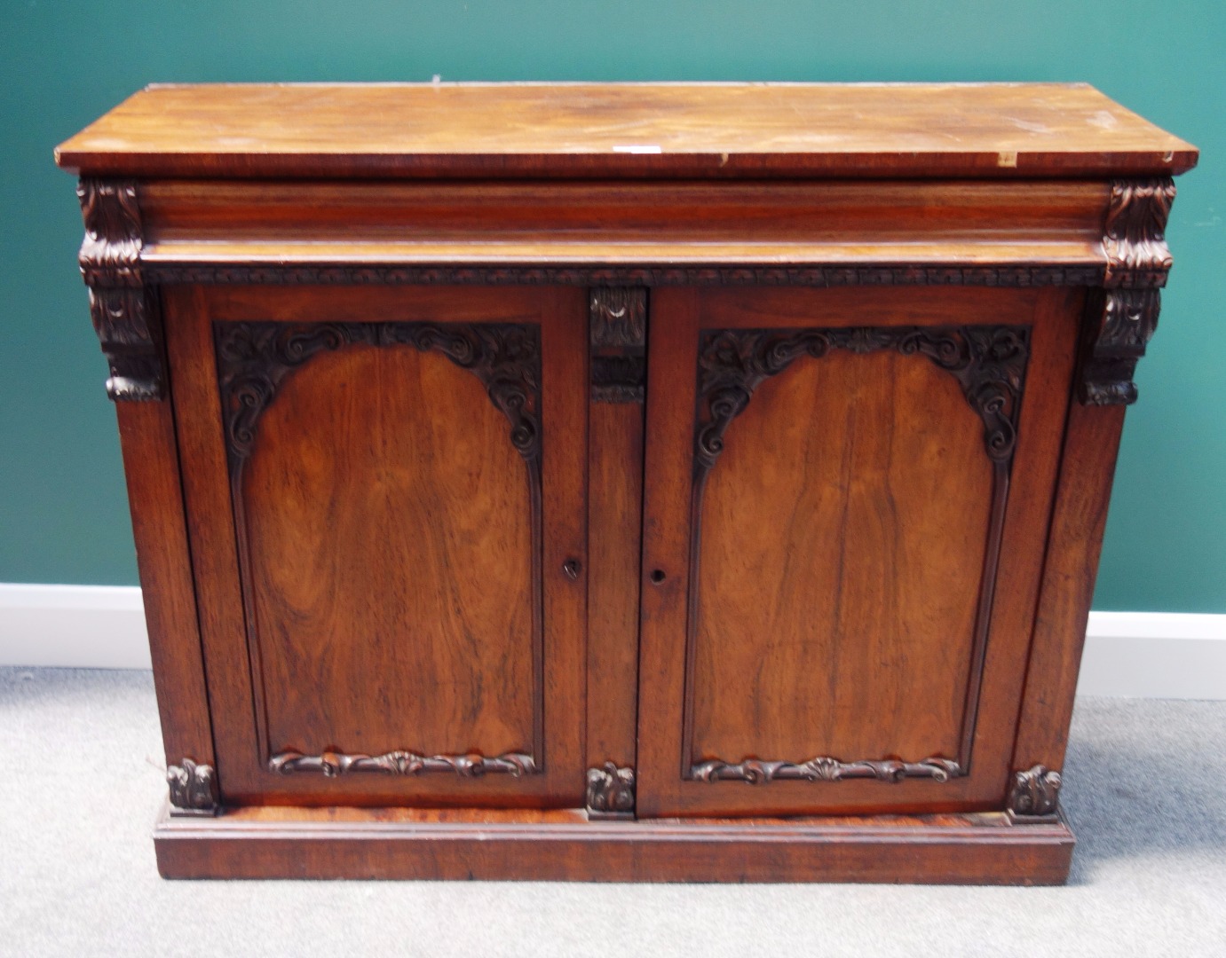 Appraisal: A William IV rosewood chiffonier the carved back over cushion