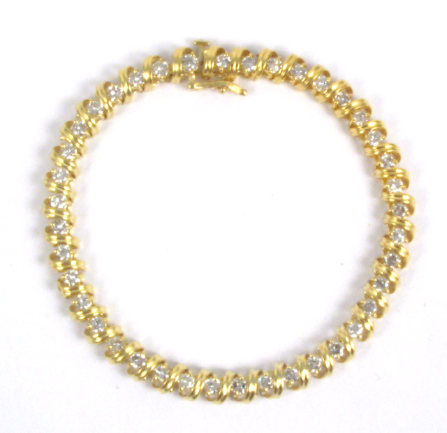 Appraisal: DIAMOND AND FOURTEEN KARAT GOLD BRACELET set with round-cut diamonds