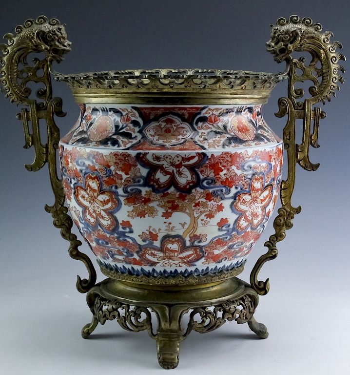 Appraisal: Japanese Bronze Mounted Imari Porcelain Pot Vase Crafted of fine