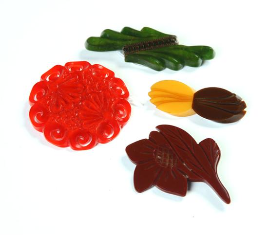 Appraisal: FOUR EARLY PLASTIC PINS American Ca - Brown bakelite flower