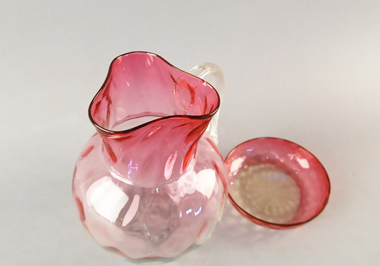 Appraisal: Two Pieces of L th C Rubina Glass an optic