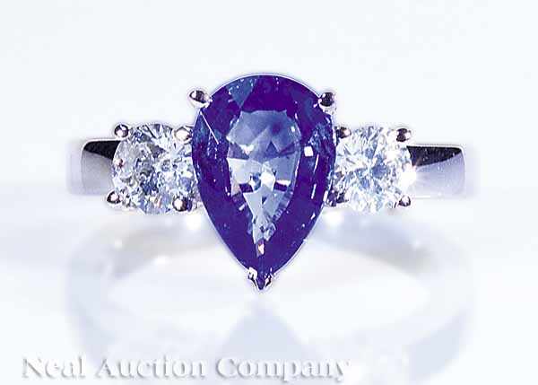 Appraisal: A Platinum Sapphire and Diamond Ring set with a pear-shaped