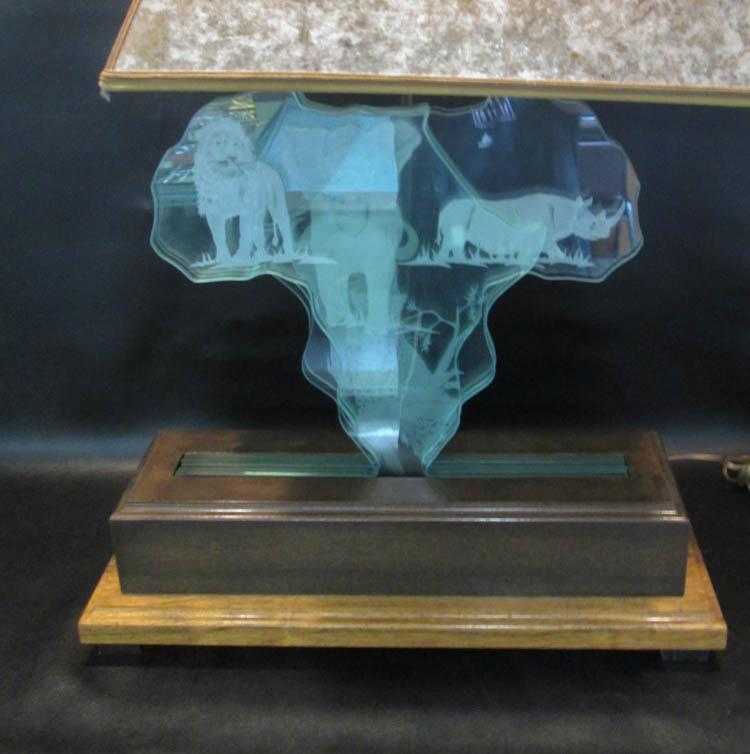 Appraisal: GLASS AFRICAN STYLE TABLE LAMP with shaped clear glass panels