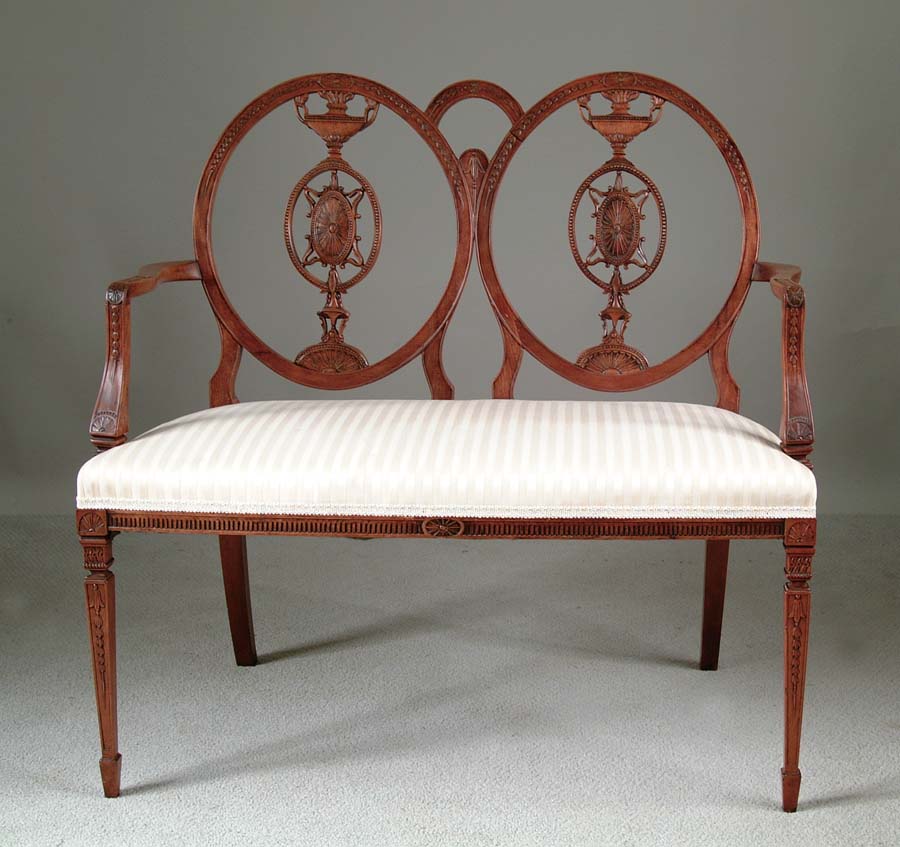 Appraisal: CARVED WALNUT SETTEE Beautifully delicate carved settee has double medallion