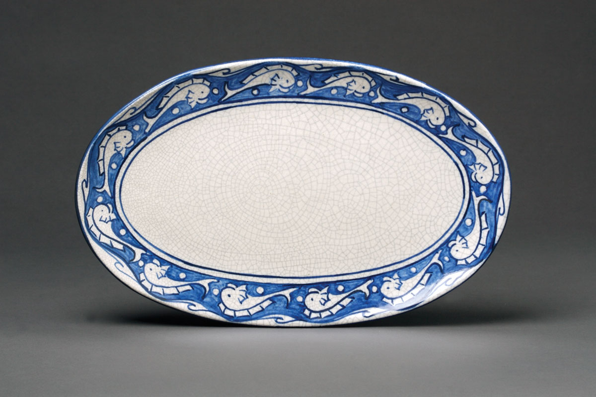 Appraisal: DEDHAM POTTERY 'DOLPHIN' PATTERN OVAL PLATTER Painted in medium blue