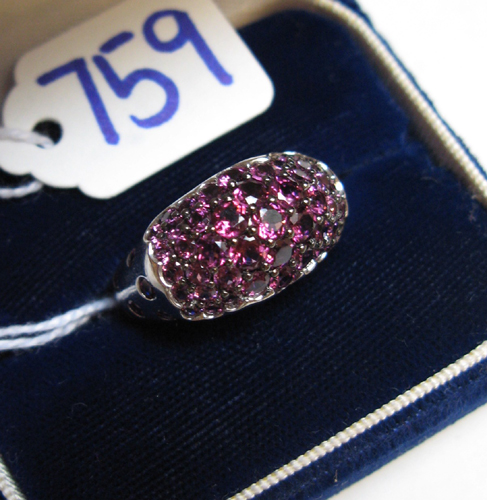 Appraisal: GRAPE TOURMALINE AND FOURTEEN KARAT WHITE GOLD RING the top