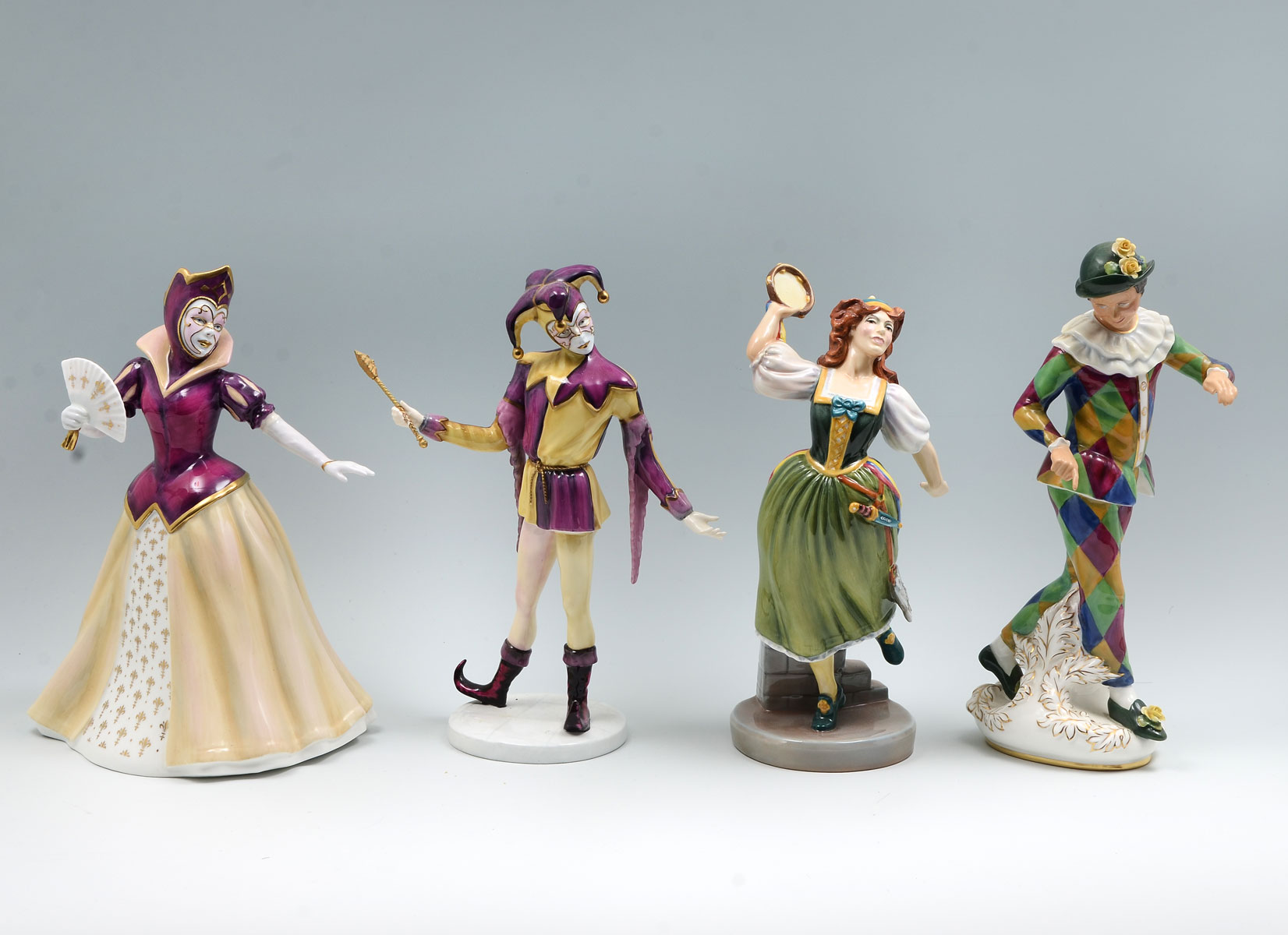 Appraisal: PC LARGE ROYAL DOULTON JESTER'S HARLEQUIN FIGURES ''The Venetian Masquerade