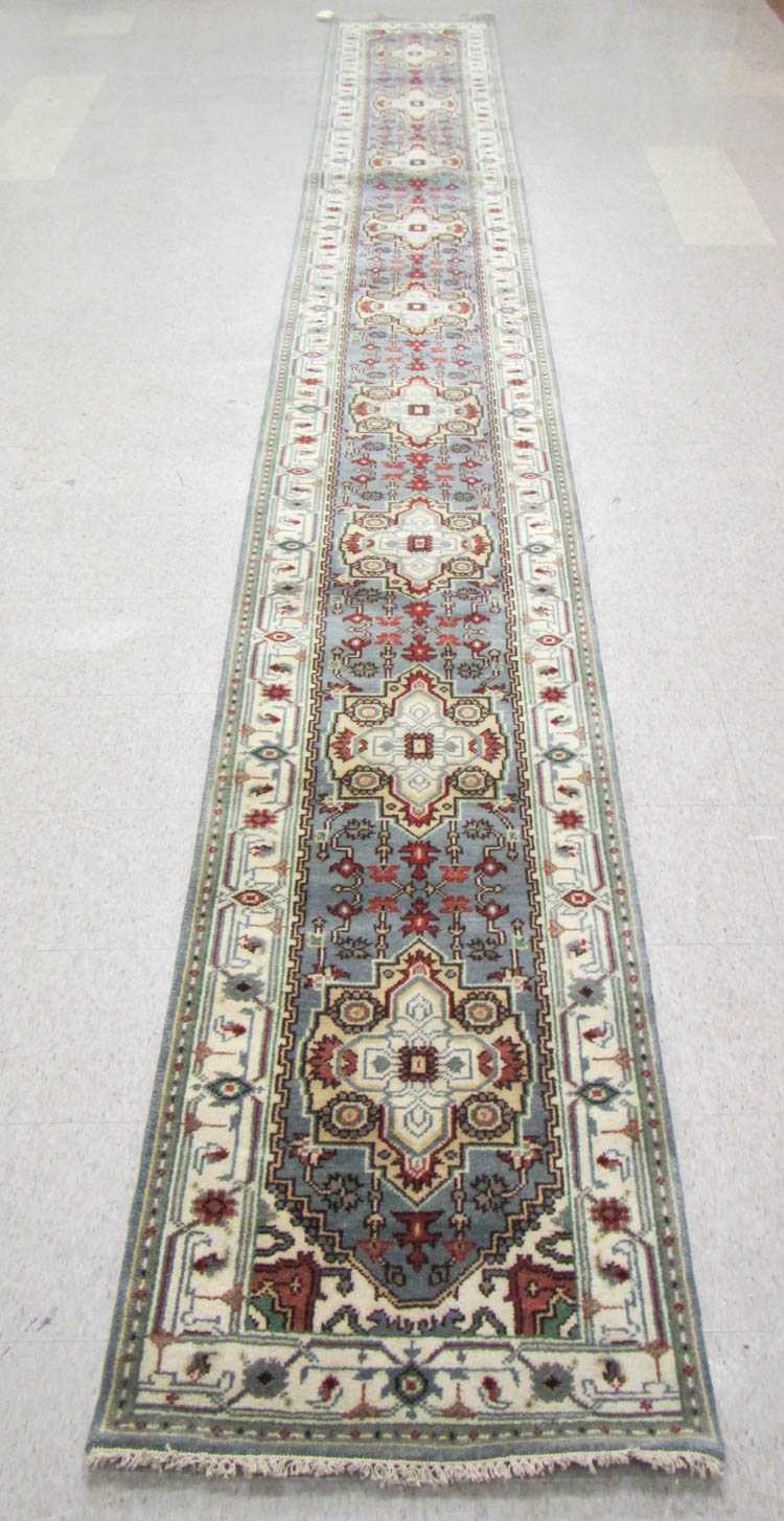 Appraisal: HAND KNOTTED ORIENTAL LONG RUG Persian Serapi design composed of