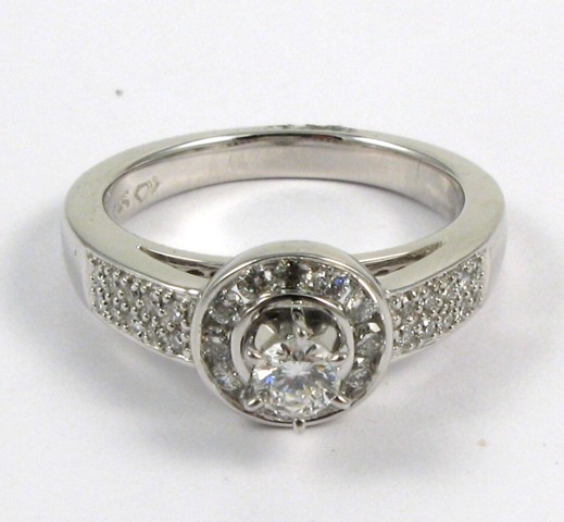 Appraisal: DIAMOND AND FOURTEEN KARAT WHITE GOLD RING centering a round