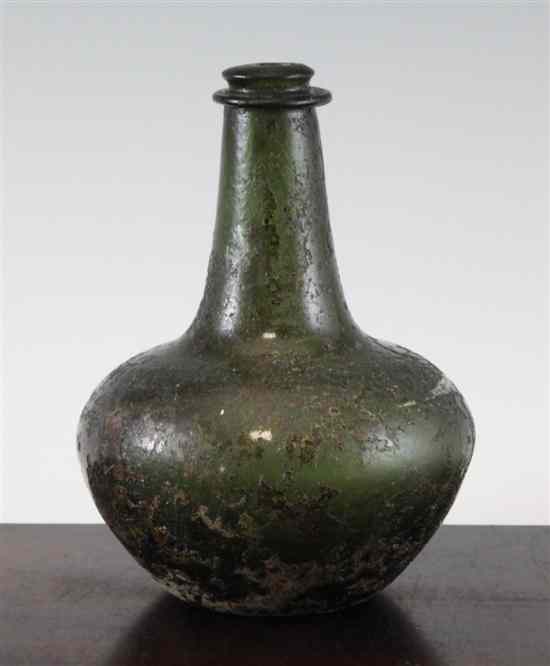 Appraisal: A shaft and globe wine bottle c with surface patination