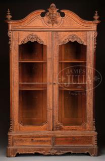 Appraisal: VICTORIAN ROCOCO REVIVAL-STYLE CARVED OAK BOOKCASE Third quarter th century