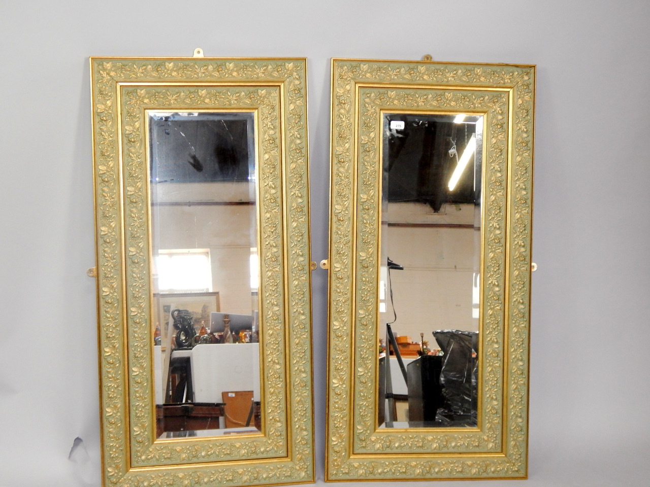 Appraisal: A pair of rectangular gilt double frame wall mirrors with