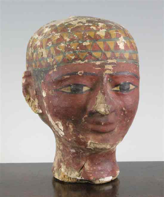 Appraisal: An Egyptian painted stucco head of a man in under