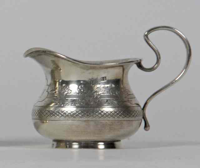 Appraisal: A Russian silver jug cyrillic mark IA Moscow of compressed