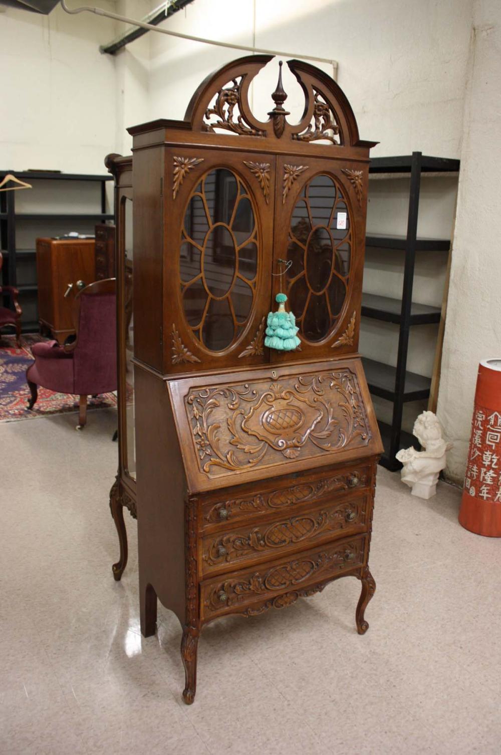 Appraisal: RELIEF-CARVED MAHOGANY SECRETARY BOOKCASE American mid- th century a double-door