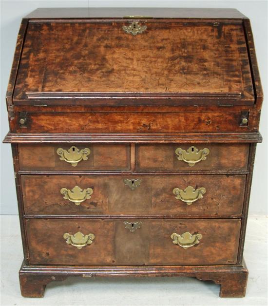 Appraisal: George II walnut bureau on bracket feet with two long