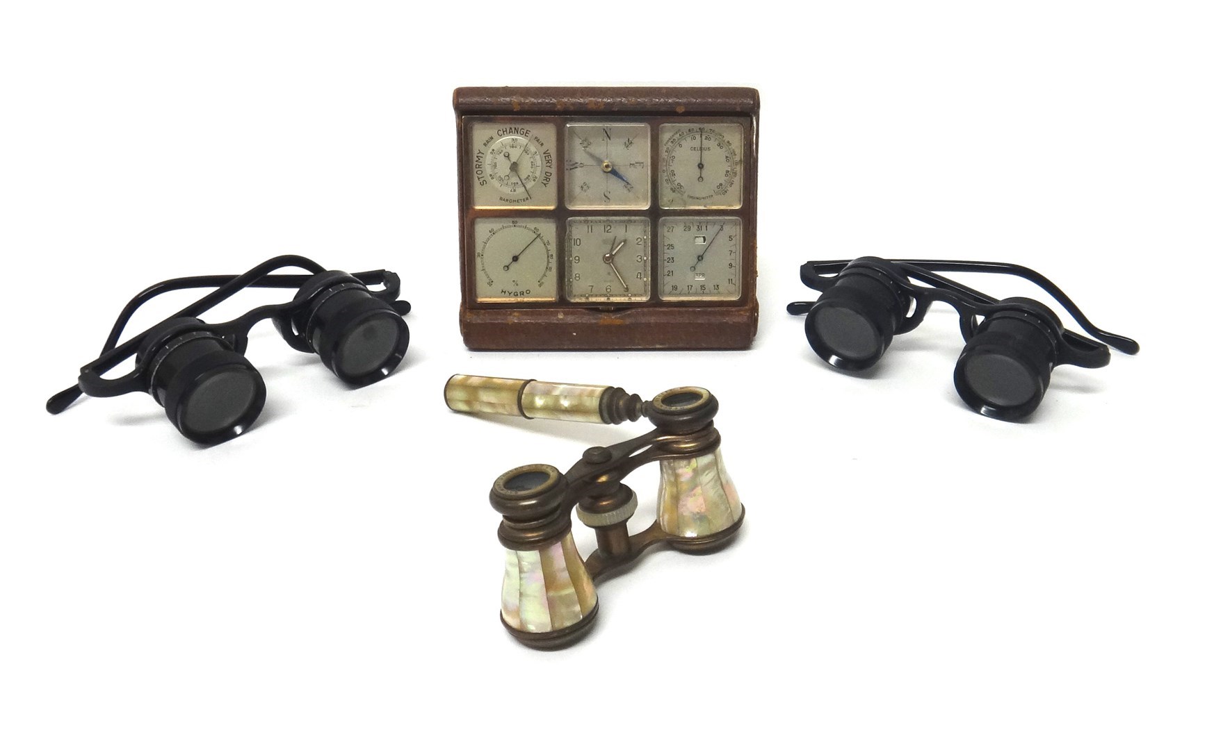 Appraisal: A leather cased Angelus Sixsone Swiss multi function travelling clock