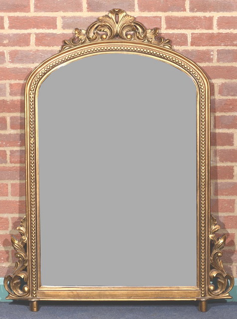 Appraisal: A VICTORIAN STYLE GILTWOOD OVERMANTEL MIRROR with foliate swag ornament