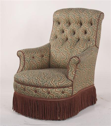 Appraisal: A Victorian upholstered low armchair the inswept buttoned back padded