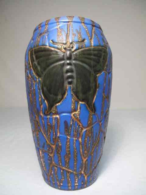 Appraisal: Czechoslovakian art pottery vase Blue gold drip glaze with buttery