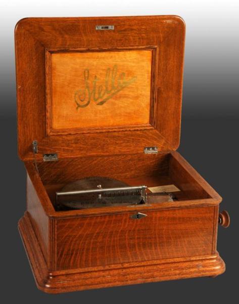 Appraisal: Wooden Stella Music Box in Oak Description Working Includes -