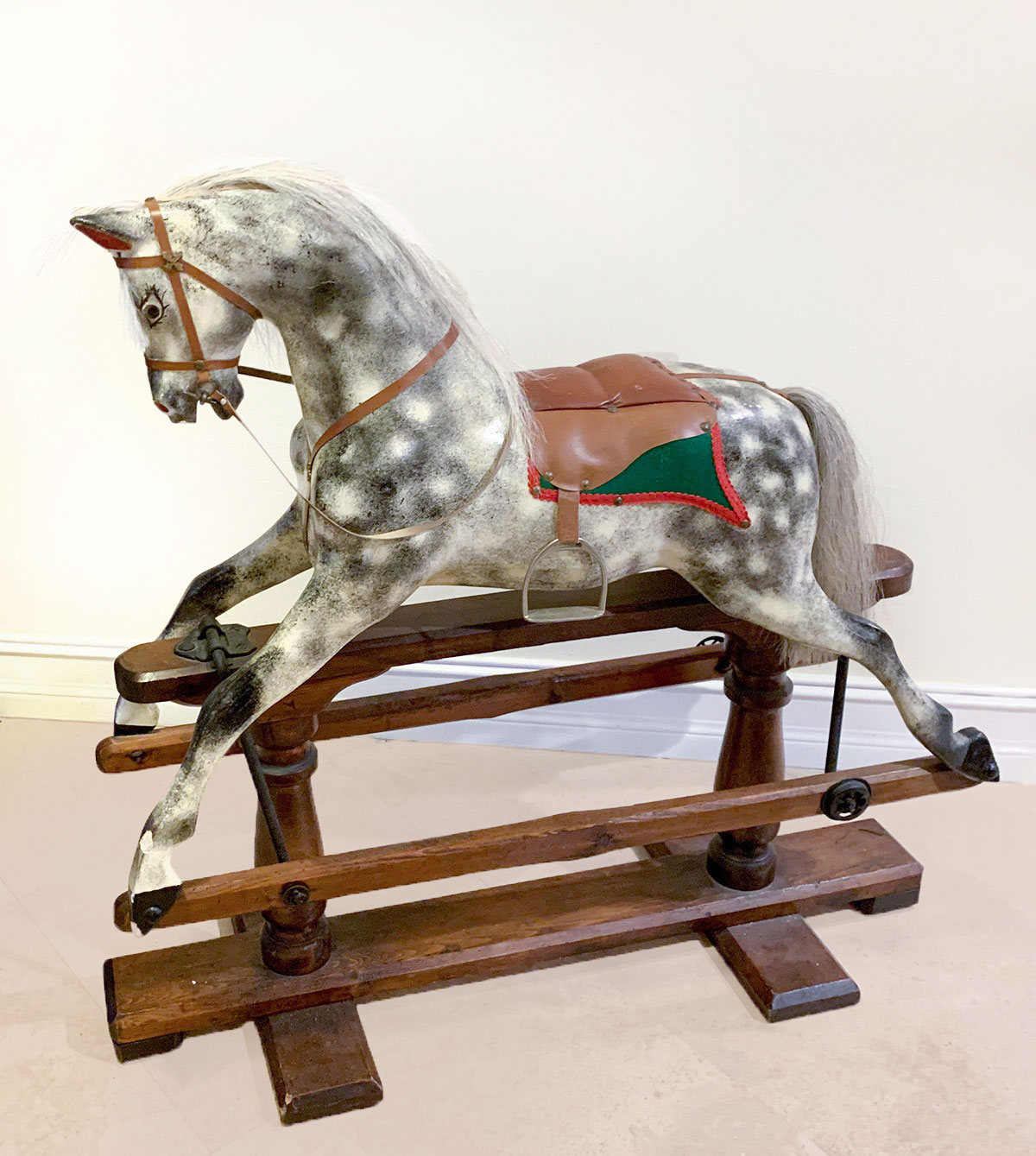 Appraisal: ANTIQUE ROCKING HORSE Carved rocking horse having a black white