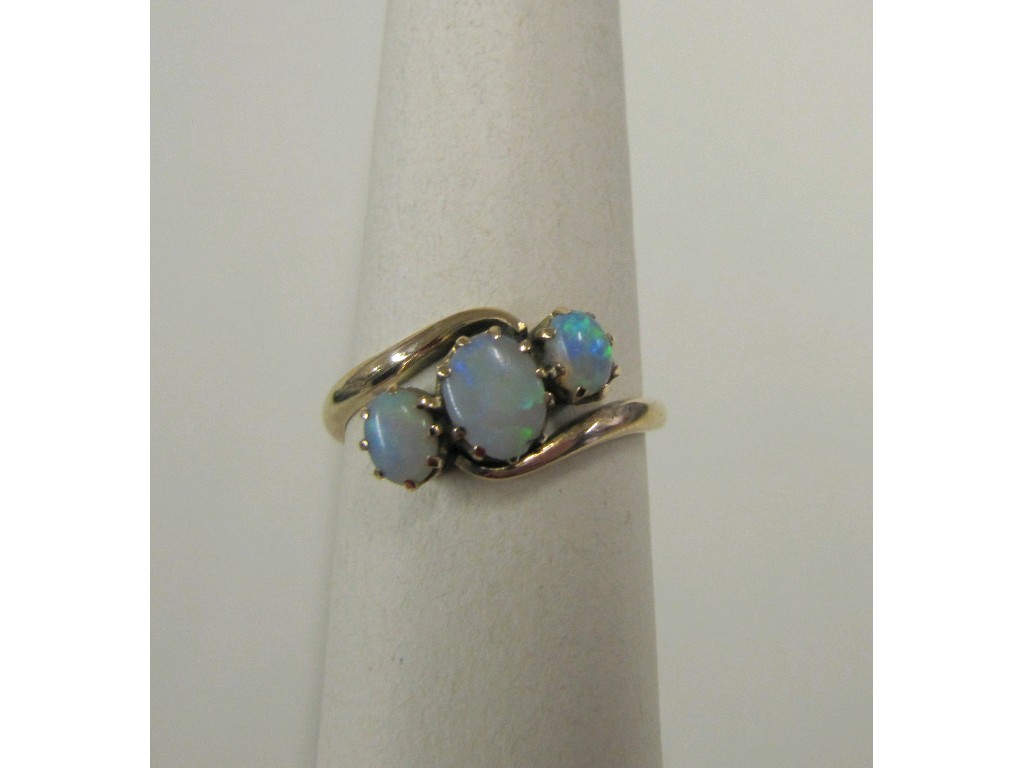 Appraisal: Gold opal three stone twist ring