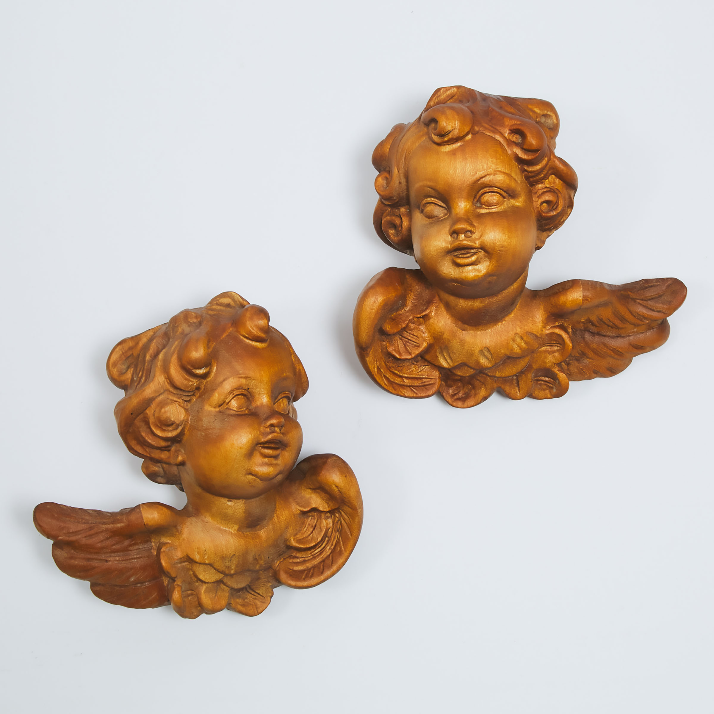 Appraisal: Pair of Italian Baroque Style Carved Walnut Winged Cherubic Heads