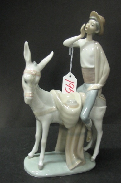 Appraisal: A LLADRO GLAZED PORCELAIN FIGURE of a young man riding