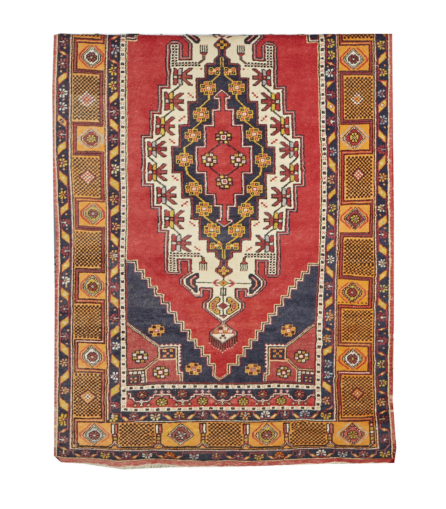 Appraisal: A LARGE TURKISH HAND KNOTTED WOOL RUG Geometric designs in