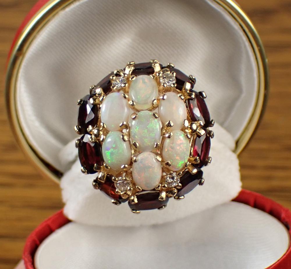 Appraisal: OPAL GARNET DIAMOND AND FOURTEEN KARAT GOLD RING set with