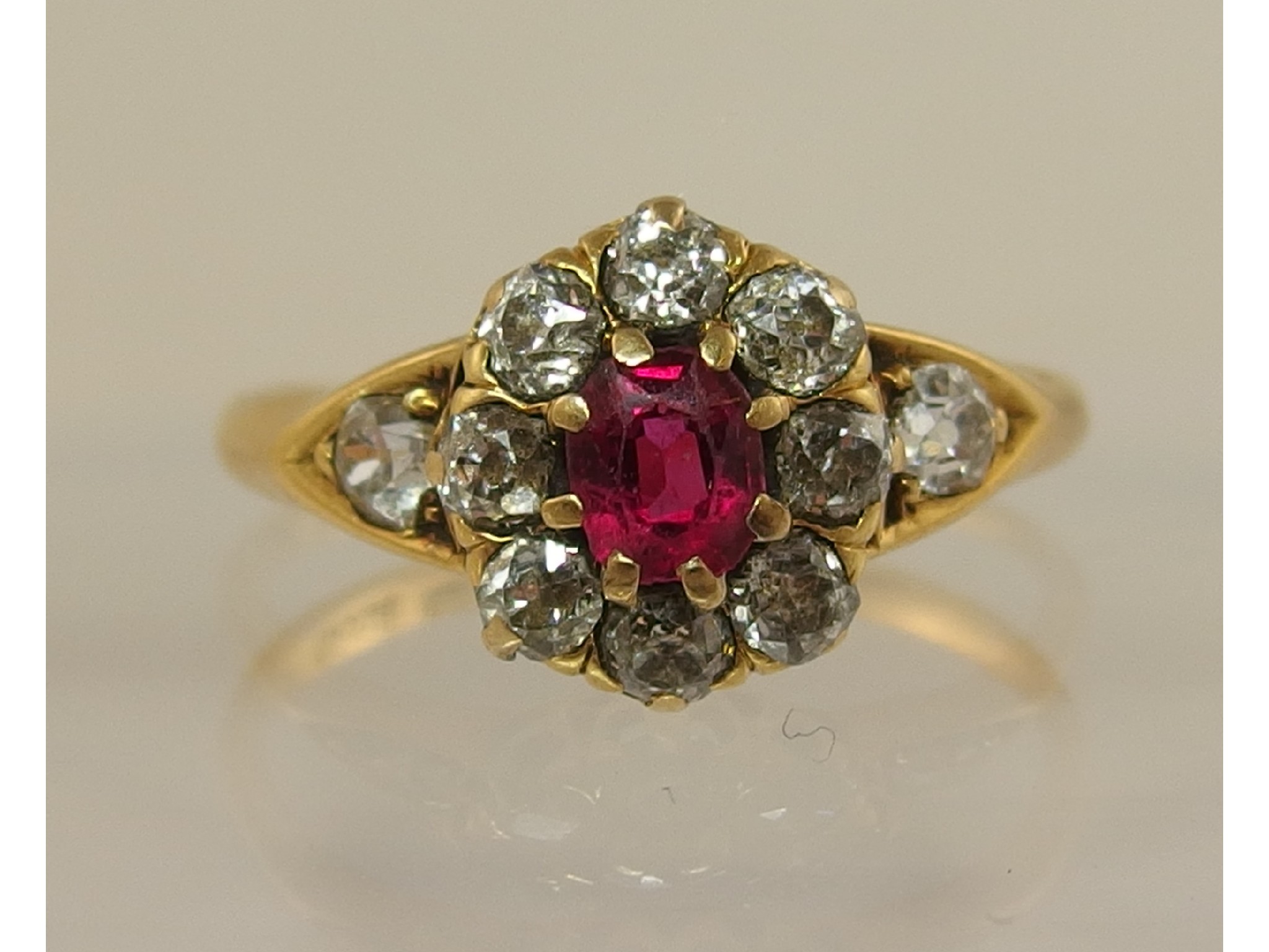 Appraisal: A yellow metal diamond and red gem cluster ring partial