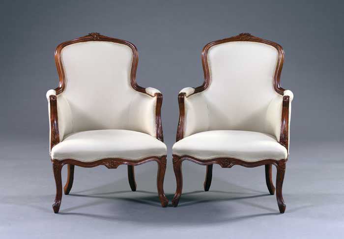 Appraisal: Pair of Louis XV-Style Fruitwood Bergeres each with a slightly