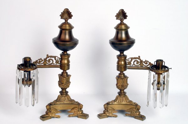 Appraisal: Pair Argand lamps Egyptian revival feet Scroll arms Prisms Cast