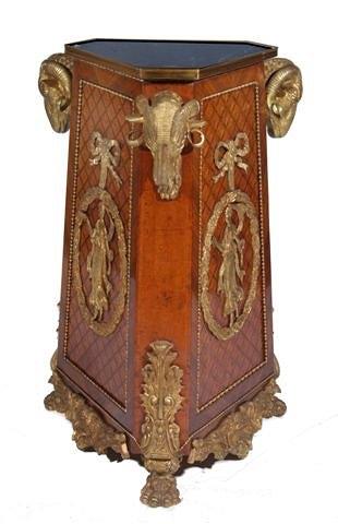 Appraisal: A FRENCH INLAID MARBLE TOP TRIANGULAR PEDESTAL with gilt rams