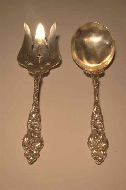 Appraisal: REED BARTON SERVING SPOON AND FORK cast with orchids and