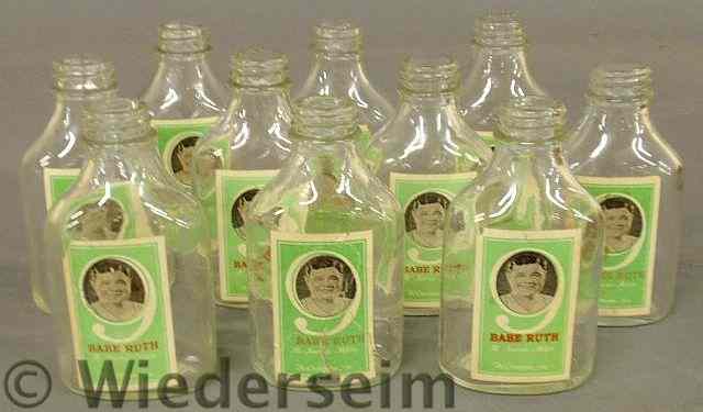 Appraisal: Set of ten bottles with paper labels showing a photograph