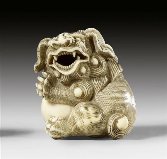 Appraisal: AN IVORY NETSUKE OF A SHISHI SIGNED GYOKUZAN Japan Meiji