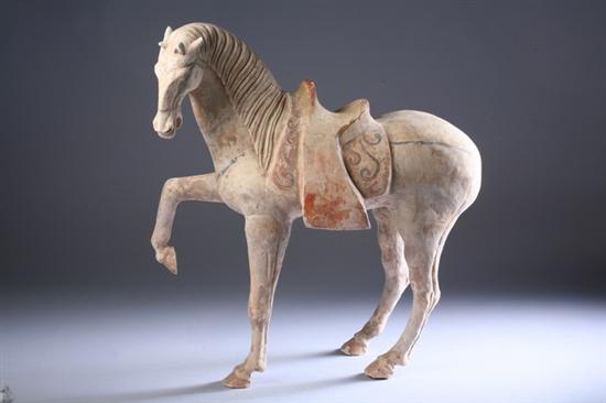 Appraisal: CHINESE PAINTED POTTERY FIGURE OF PRANCING HORSE Tang Dynasty -