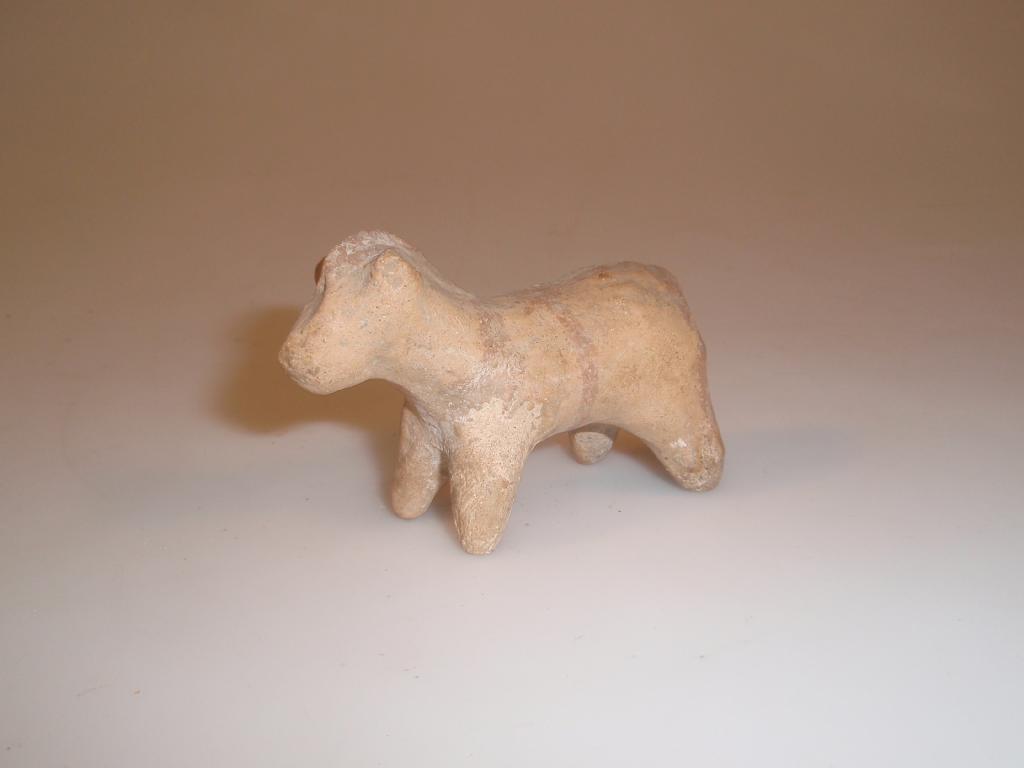 Appraisal: A zoomorphic terracotta figurine of a quadruped possibly a sheep